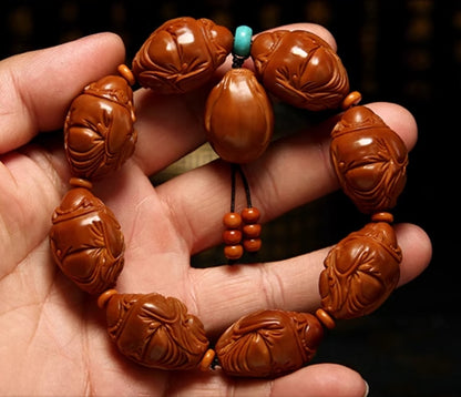 Olive Kernel Bracelet: Eight Treasures and the God of Wealth - Oriental Treasures
